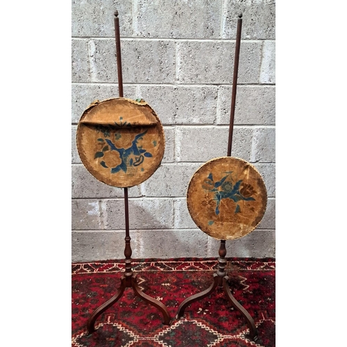 178 - A PAIR OF VICTORIAN CARVED ROSEWOOD FIRE POLE SCREENS, with oval shaped panels with embroidered flor... 