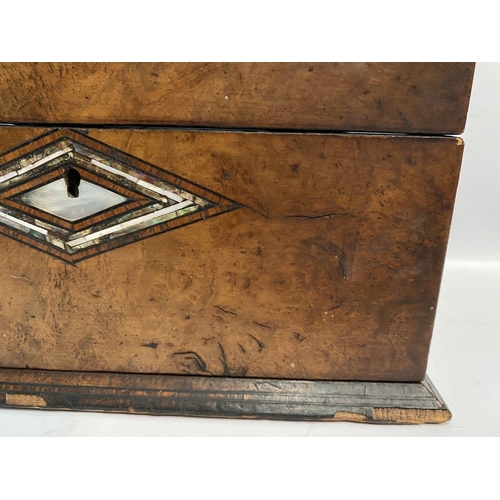 180 - A 19TH CENTURY BURR WALNUT MOTHER OF PEARL INLAID TEA CADDY, with unusual diamond form central inlay... 