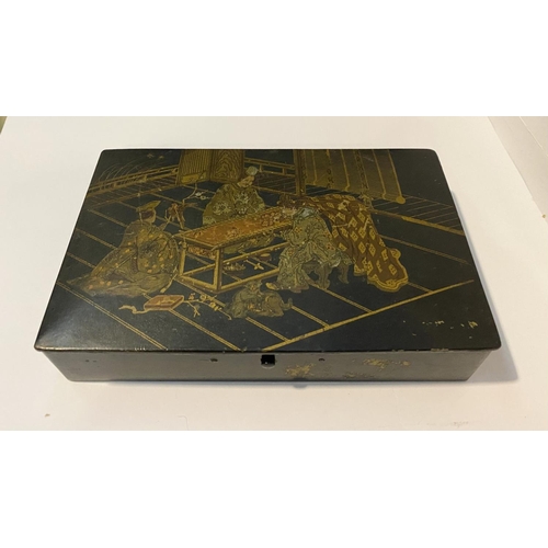 181 - A JAPANESE LAQUERED WRITING BOX, the wooden box is lacquered and decorated with depiction of three f... 