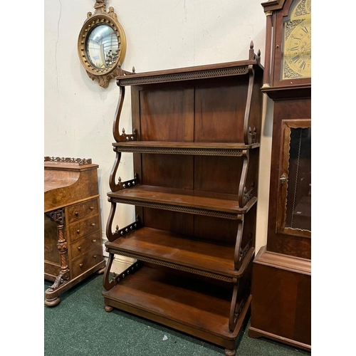 22 - AN ANTIQUE MAHOGANY WATERFALL FLOOR BOOKCASE, with decorative pierced openwork to four graduated she... 