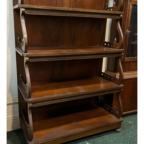 22 - AN ANTIQUE MAHOGANY WATERFALL FLOOR BOOKCASE, with decorative pierced openwork to four graduated she... 