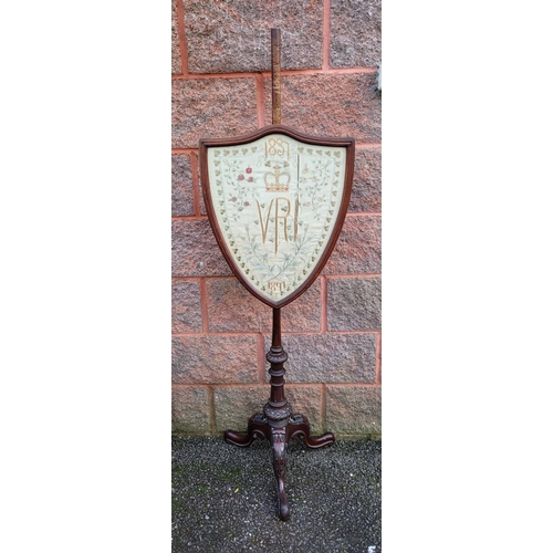 232 - A VICTORIAN POLE FIRE SCREEN, the shield shaped screen with detailed embroidery picture with inset g... 