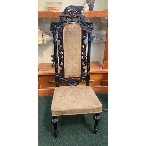 234 - A VICTORIAN EBONISED JACOBEAN STYLE HALL CHAIR, c.1880, finely carved frame with floral scrolling op... 