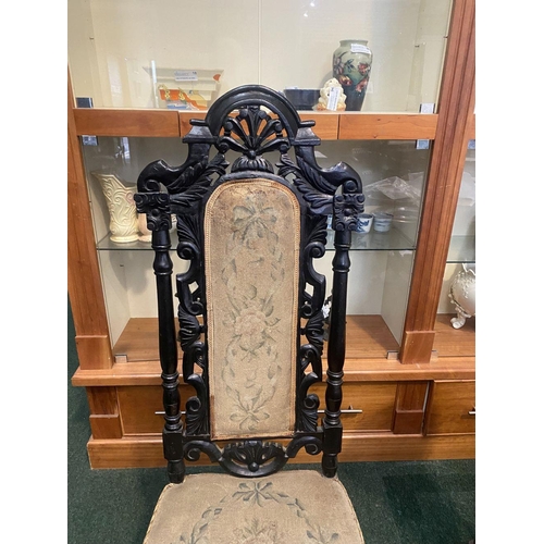 234 - A VICTORIAN EBONISED JACOBEAN STYLE HALL CHAIR, c.1880, finely carved frame with floral scrolling op... 