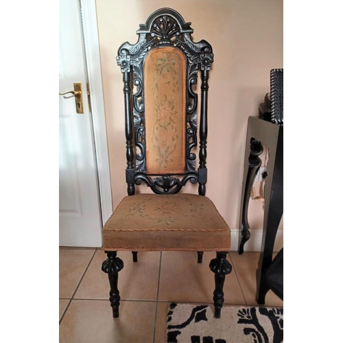 234 - A VICTORIAN EBONISED JACOBEAN STYLE HALL CHAIR, c.1880, finely carved frame with floral scrolling op... 