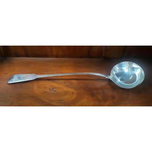 237 - AN IRISH SILVER LADLE, Maker Thomas Jones, Dublin, date mark rubbed. dimensions: 14in long approx.