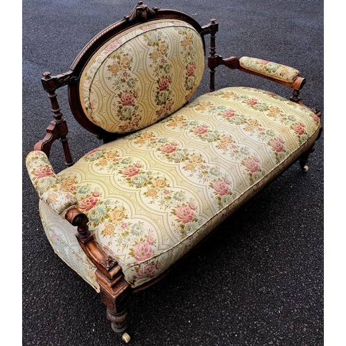 4 - AN ANTIQUE LOUIX XVI STYLE SETEE, upholstered with floral fabric, within carved mahogany frame with ... 