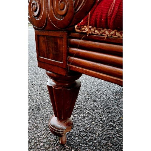 5 - AN EXCELLENT LATE VICTORIAN MAHOGANY CHAISE LOUNGE, upholstered with red fabric, having scrolling bu... 