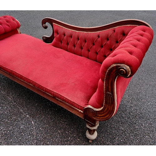 5 - AN EXCELLENT LATE VICTORIAN MAHOGANY CHAISE LOUNGE, upholstered with red fabric, having scrolling bu... 