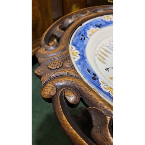 55 - AN ORNATELY CARVED 19TH CENTURY WASH STAND WITH GLAZED POTTERY BOWL, the stand is a beautiful exampl... 