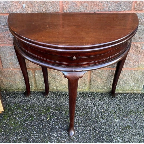 58 - A GEORGE II TEAK DEMI LUNE TEA TABLE, folding top with hinged compartment, atop moulded frieze and l... 