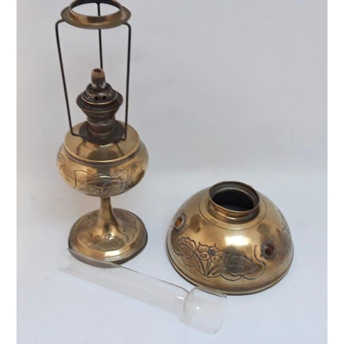 62 - AN ANTIQUE BRASS OIL LAMP, shade with engraved floral design, shade complete with glass chimney, dim... 