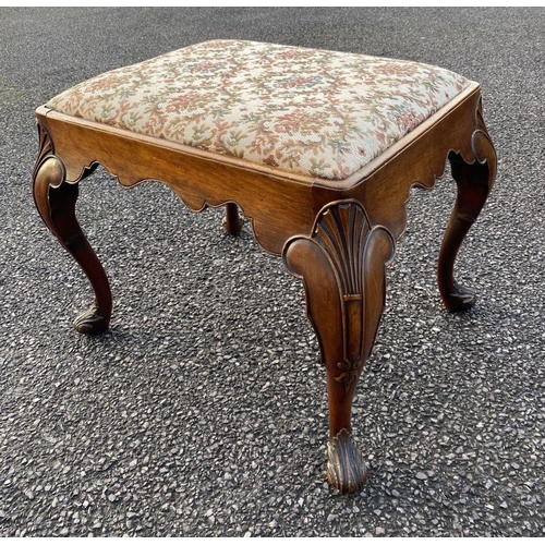 63 - AN ANTIQUE QUEEN ANNE STYLE WALNUT DRESSING TABLE STOOL, with upholstered padded seat atop carved sc... 