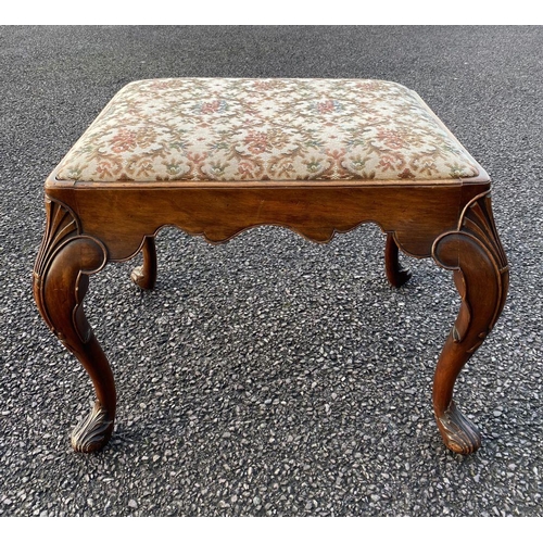 63 - AN ANTIQUE QUEEN ANNE STYLE WALNUT DRESSING TABLE STOOL, with upholstered padded seat atop carved sc... 