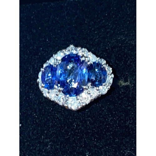 66 - AN ORNATE 18CT WHITE GOLD CEYLON DIAMOND CLUSTER RING, three Ceylon Sapphires surrounded by brillian... 