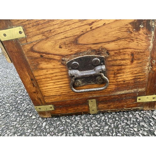 70 - A 19TH CENTURY CAMPAIGN TRUNK, brass bindings, and carrying handles to sides. Dimensions: 69cm wide ... 