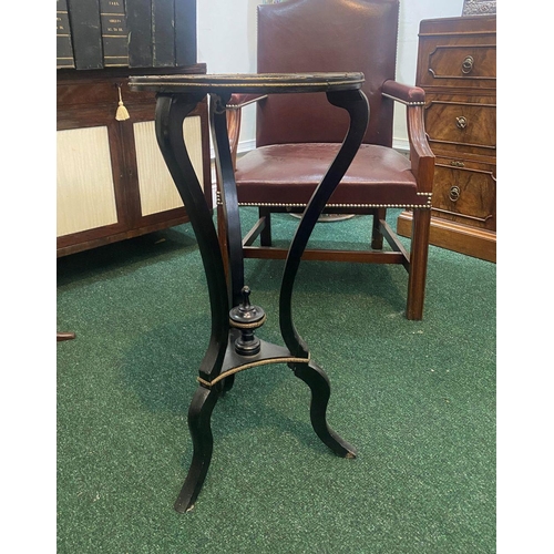 73 - A LATE 19TH CENTURY ROSEWOOD TABLE, with decorative mother of pearl inset to circular top, brass mou... 