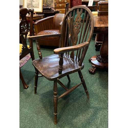 75 - A PAIR OF WHEELBACK WINSOR COUNTRY CHAIRS, spindle backed with carved back splat, turned supports to... 