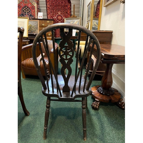 75 - A PAIR OF WHEELBACK WINSOR COUNTRY CHAIRS, spindle backed with carved back splat, turned supports to... 