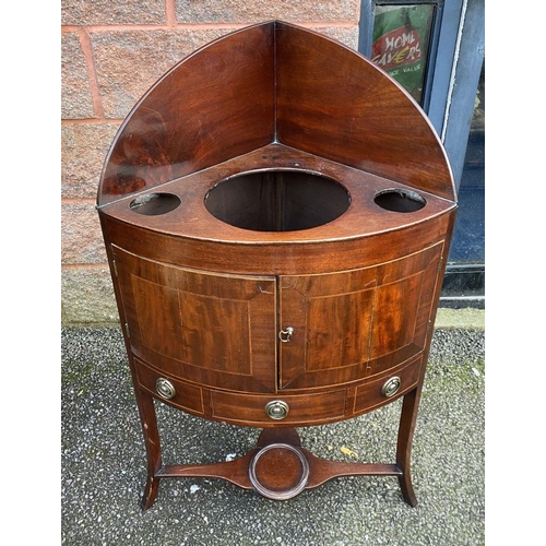 79 - A GEORGE III STYLE MAHOGANY INLAID CORNER WASHSTAND, two inlaid doors above drawer with brass handle... 