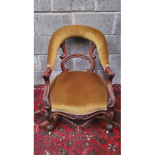 89 - A GOOD QUALITY 19TH CENTURY CARVED LOW RISE OPEN ARMCHAIR, with curved padded crest rail that runs d... 