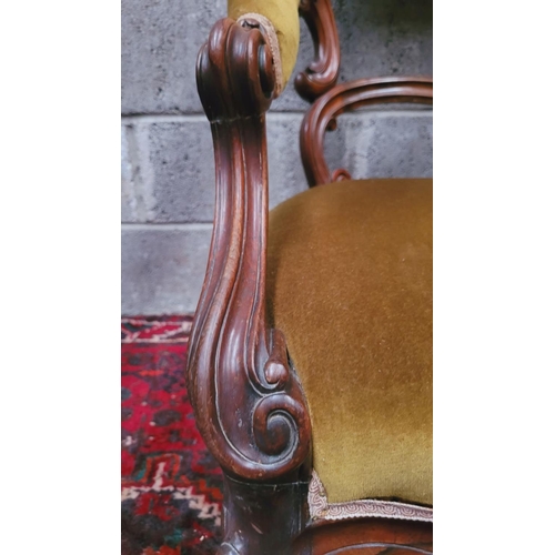 89 - A GOOD QUALITY 19TH CENTURY CARVED LOW RISE OPEN ARMCHAIR, with curved padded crest rail that runs d... 