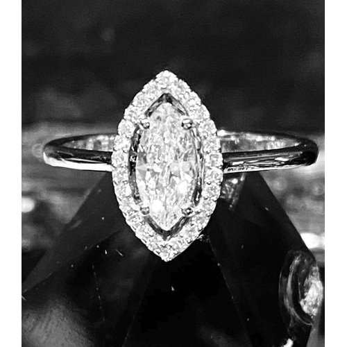 9 - AN EXCEPTIONAL 18CT WHITE GOLD MARQUISE CUT DIAMOND CLUSTER RING, central diamond surrounded by bril... 