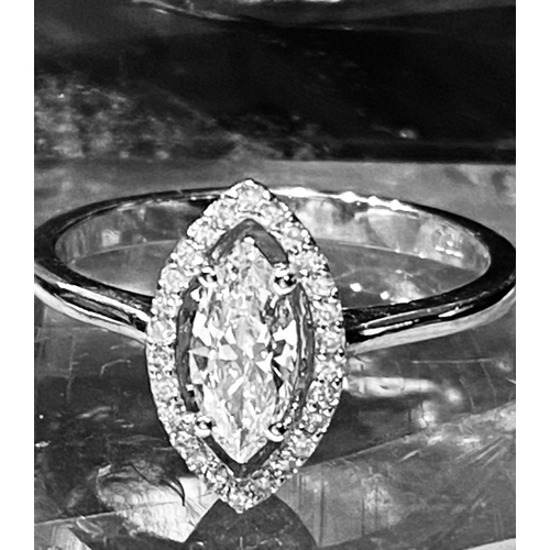 9 - AN EXCEPTIONAL 18CT WHITE GOLD MARQUISE CUT DIAMOND CLUSTER RING, central diamond surrounded by bril... 