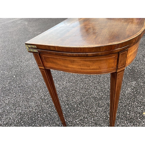 90 - A GEORGIAN MAHOGANY INLAID D-SHAPED CARD TABLE, with inlay and banding, opening to green baize lined... 