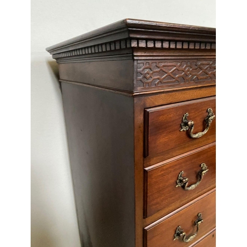 92 - AN IRISH MAHOGANY SEVEN DRAWER TALLBOY CHEST, fluted dentil cornice above carved panel, seven drawer... 