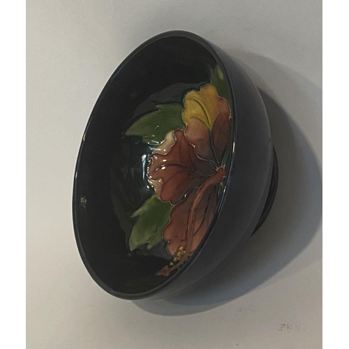 96 - A VINTAGE MOORCROFT HIBISCUS PATTERN BOWL, circular body with raised base, finely decorated with dee... 