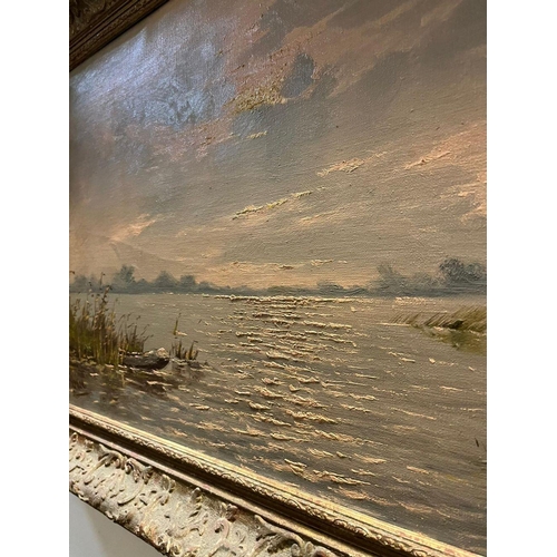 97 - A LATE 19TH/EARLY 20TH CENTURY GILT FRAMED OIL ON CANVAS, depicting lake/river landscape, signed ind... 