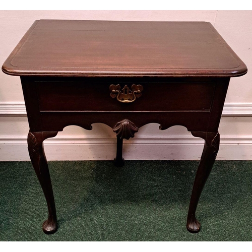 10 - AN IMPORTANT IRISH QUEEN ANNE SIDE TABLE with original brass handle and clam cartouche centre; wave ... 