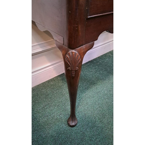 10 - AN IMPORTANT IRISH QUEEN ANNE SIDE TABLE with original brass handle and clam cartouche centre; wave ... 