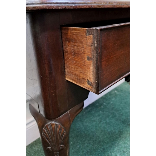 10 - AN IMPORTANT IRISH QUEEN ANNE SIDE TABLE with original brass handle and clam cartouche centre; wave ... 