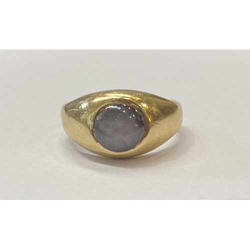 11 - A STRIKING 14CT GOLD CABOCHON WHITE STAR SAPPHIRE SIGNET RING, this natural round white star sapphir... 