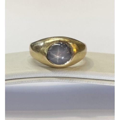 11 - A STRIKING 14CT GOLD CABOCHON WHITE STAR SAPPHIRE SIGNET RING, this natural round white star sapphir... 