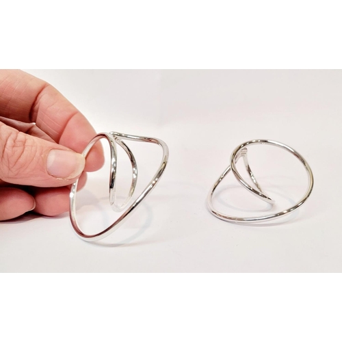 110 - A PAIR OF GEORG JENSEN STERLING SILVER 'INFINITY' EAR CUFFS, a lovely dynamic pair of ear cuffs that... 