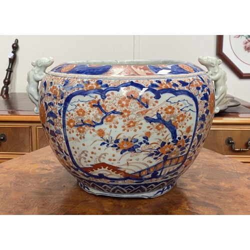 132 - AN EXCELLENT LARGE IMARI JARDINIERE, with painted panels to front and reverse depicting cherry bloss... 