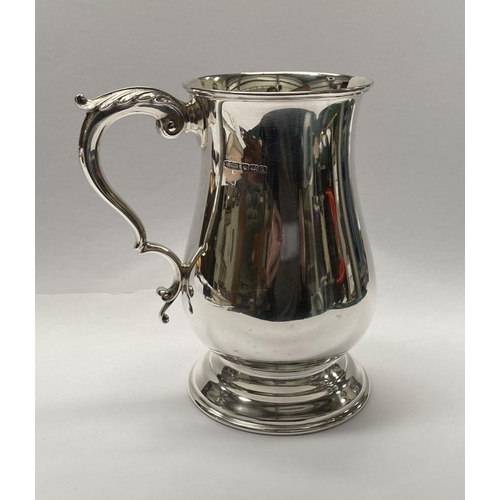 139 - A VINTAGE SILVER TANKARD, Maker James Dixon & Sons Ltd Sheffield, 1943, of baluster form, with acant... 