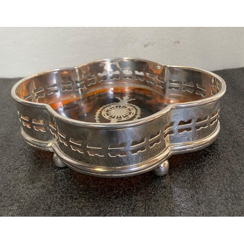 14 - A PAIR OF SHAPED SILVER PLATED WINE COASTERS, with pierced openwork design to border, tortoiseshell ... 