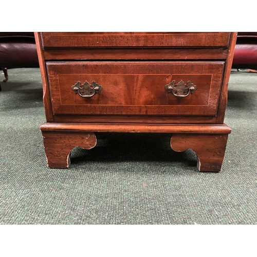 15 - A GEORGIAN FIVE DRAWER MAHOGANY CHEST, with crossbanding and inlay to drawers and top, drawers compl... 