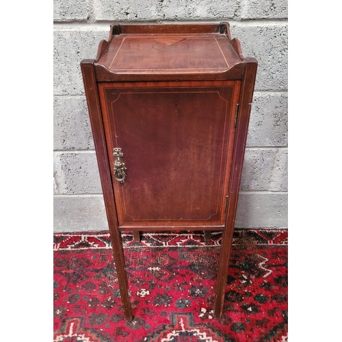 156 - A LATE 19th / EARLY 20TH CENTURY MAHOGANY STRING INLAID CABINET, with brass pull-ring handle to the ... 