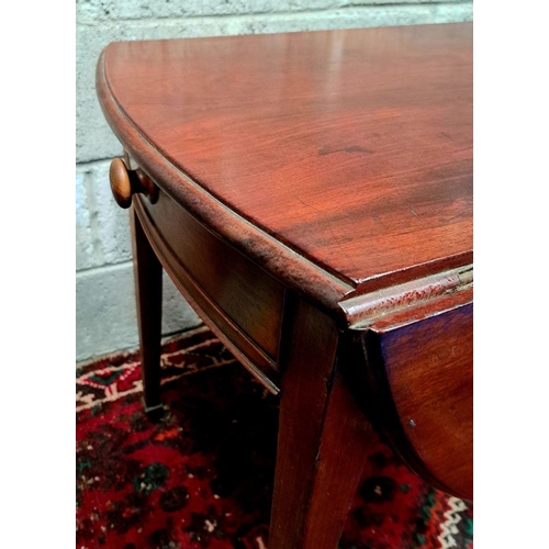 163 - A GEORGIAN-STYLE MAHOGANY DROP-LEAF TABLE bevelled edge; cockbeaded drawers with wooden knobs, taper... 