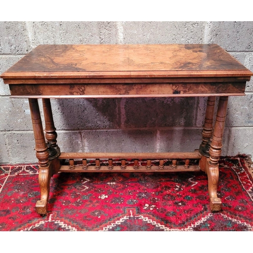 166 - AN EARLY 20TH CENTURY WALNUT & MAHOGANY FOLD OVER CARD TABLE, the top surface twists and folds open ... 