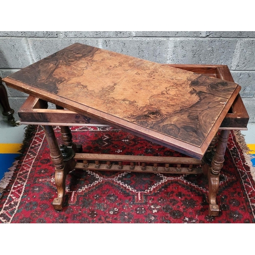 166 - AN EARLY 20TH CENTURY WALNUT & MAHOGANY FOLD OVER CARD TABLE, the top surface twists and folds open ... 