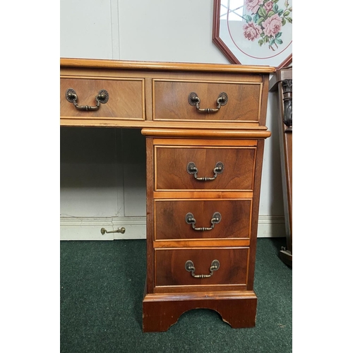 17 - AN EXCELLENT KEYHOLE/PEDESTAL DESK, with leather inset to top above nine panelled drawers with brass... 