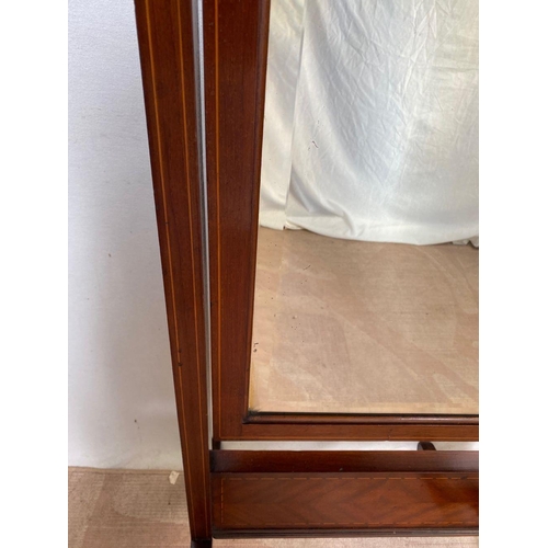 19 - A MAHOGANY INLAID CHEVAL MIRROR, with arched top, bevelled glass, inlay to frame and base with cross... 