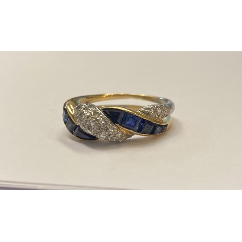 20 - A FANTASTIC TIFFANY & CO. TWO TONE SAPPHIRE AND DIAMOND TWIST RING, 1ct round brilliant cut diamonds... 