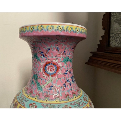 22 - A LARGE 20TH CENTURY CHINESE FAMILLE ROSE PORCELAIN VASE, of baluster form, decorated with painted s... 